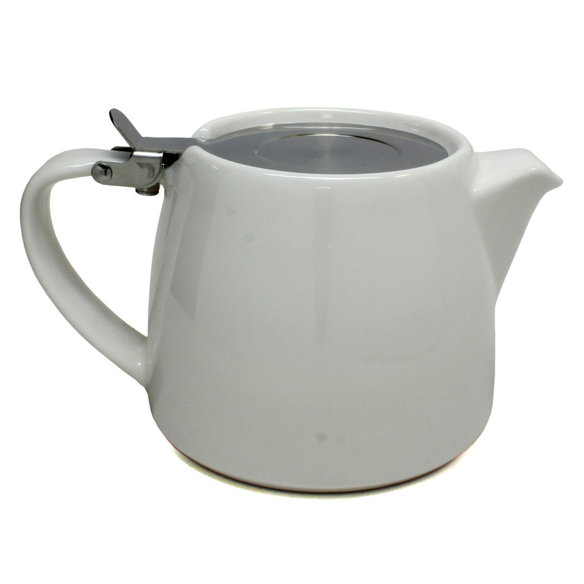 A white ceramic teapot with a flip lid and mesh brew basket inside on a white background. 