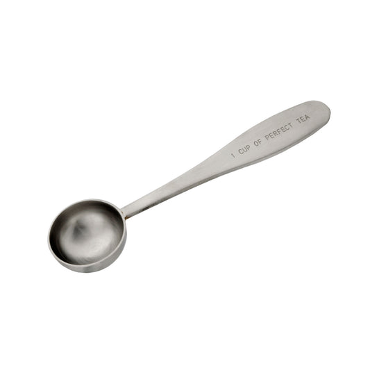 A stainless steel teaspoon with the inscription 'CUP OF PERFECT TEA' on the handle.