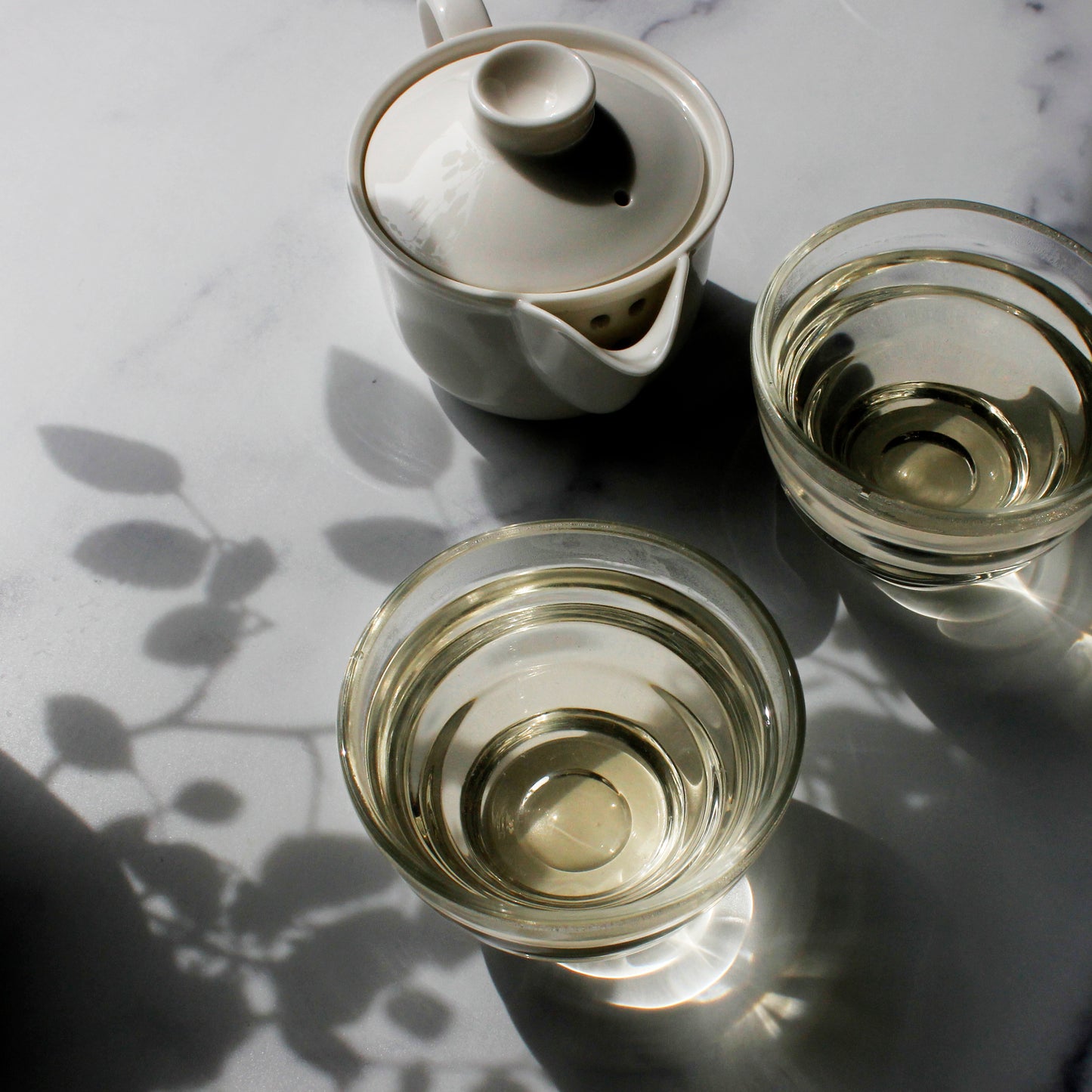 Cherry Blossom - infusion in two glass cups and a pitcher. Tasting Notes:
sour cherry • pineapple • jasmine