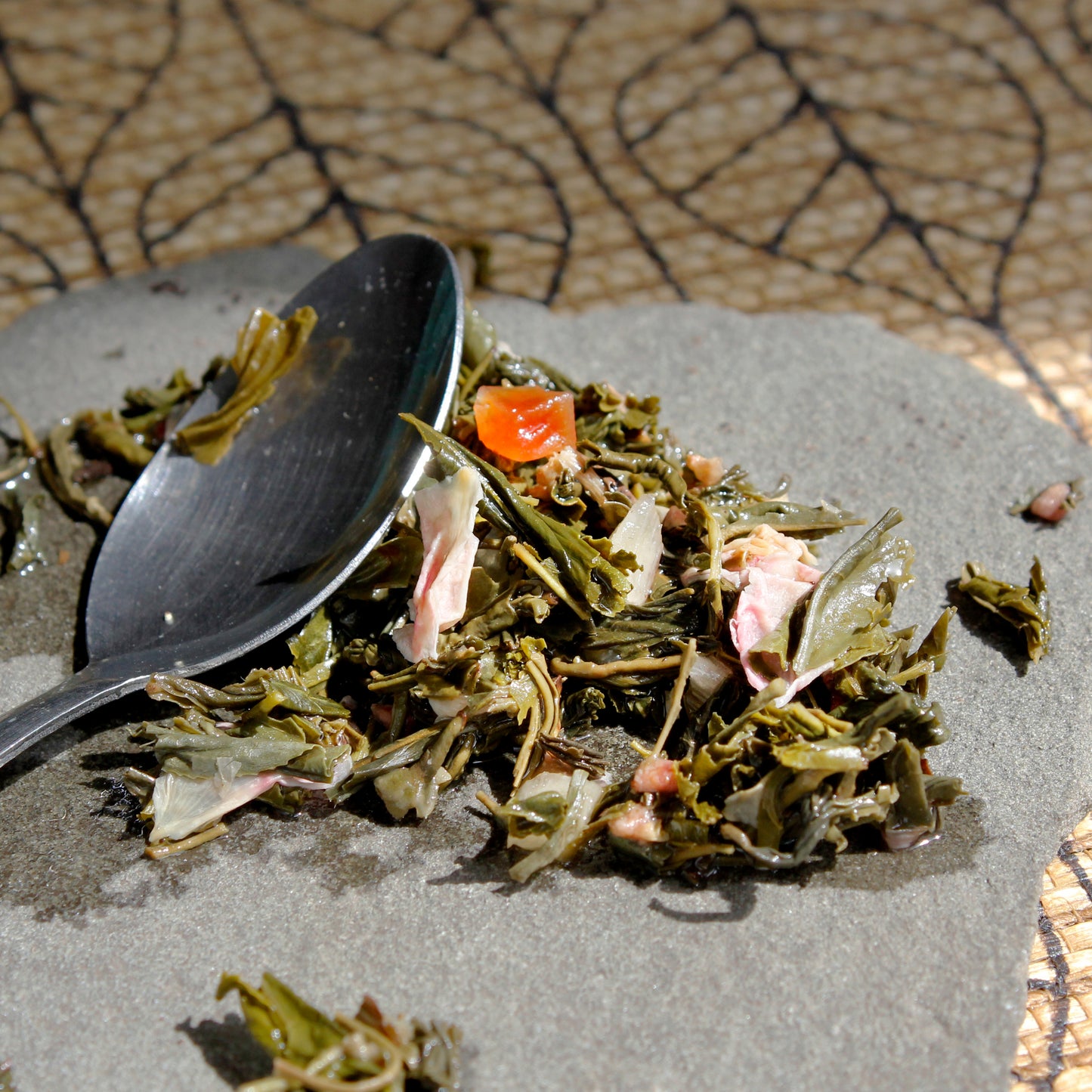 Cherry Blossom - wet leaves with spoon on a pattern table cloth. Tasting Notes:
sour cherry • pineapple • jasmine