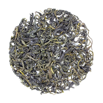 Loose pile of China Green Jade: Mao Jian on a white background. Ingredients: Camellia sinensis leaves.