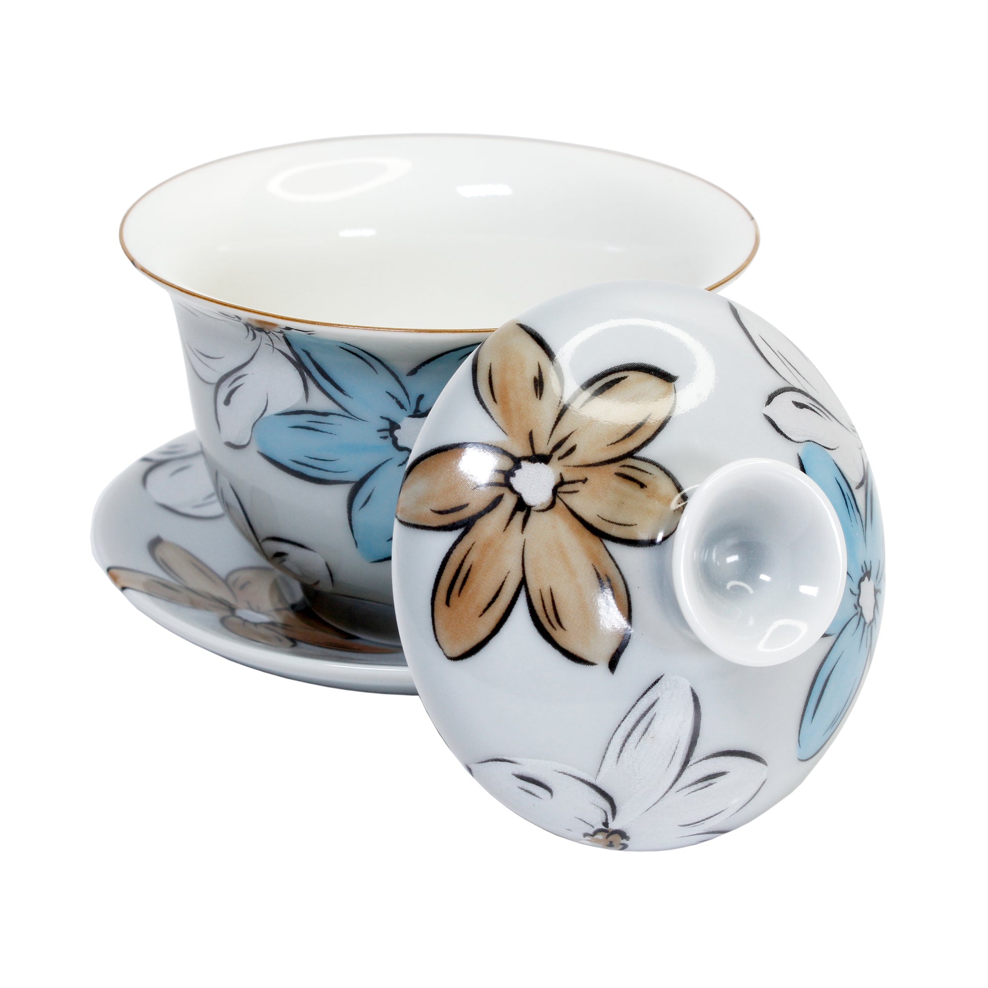 Ceramic gaiwan with light blue, white and light brown floral design white matching lid and saucer on  a white background